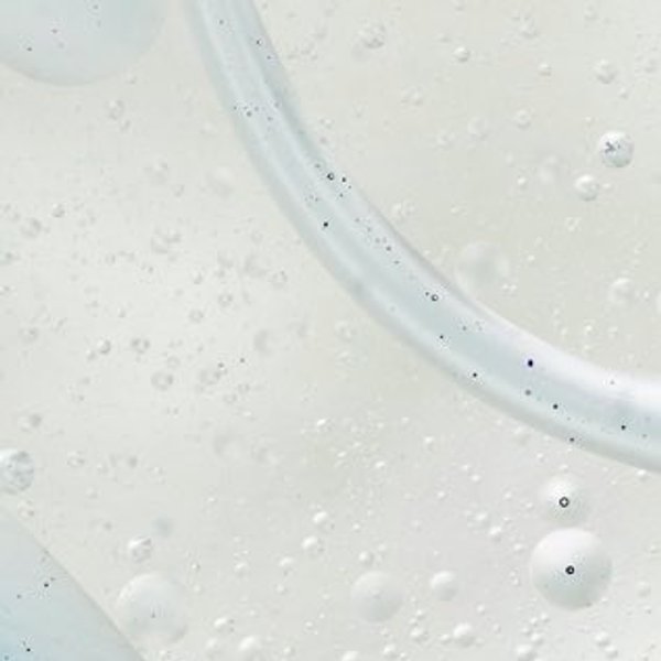 A close-up photo of a skincare product bottle, showing Niacinamide ingredient information