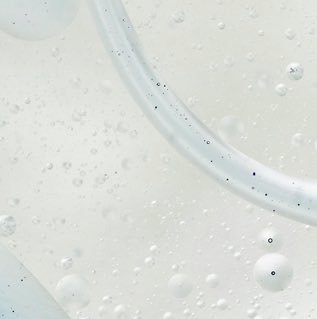 A close-up photo of a skincare product bottle, showing Niacinamide ingredient information